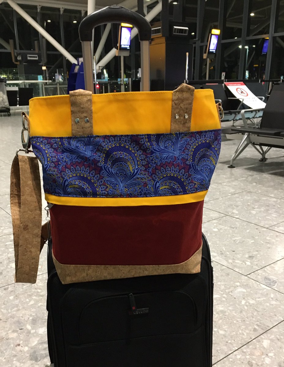 cottonsox9's tweet photo. As seen at Heathrow Airport my Shweshwe, cork and waxed canvas Waterlily tote bag. She more than stood the test of travel abuse and came out tops for space and durability. I highly recommend bags by cotton-sox 😉 https://t.co/Xy6ouhihMo