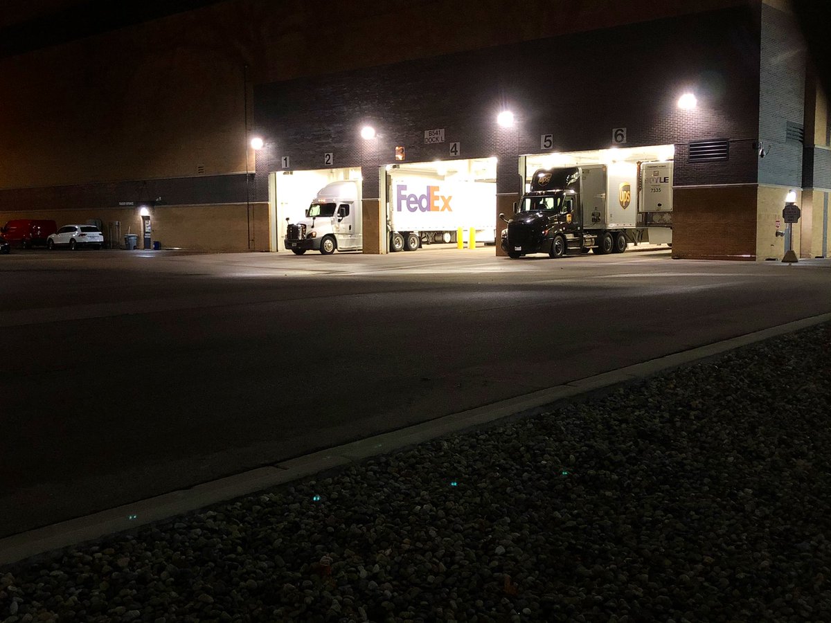 petemuntean's tweet photo. Early morning action here at Pfizer’s Kalamazoo, Michigan facility. These UPS and FedEx trucks carrying the vaccine will head to airports. Doses arrive at 600+ hospitals and pharmacies starting tomorrow, more on Tuesday. https://t.co/0ukt2shIfp
