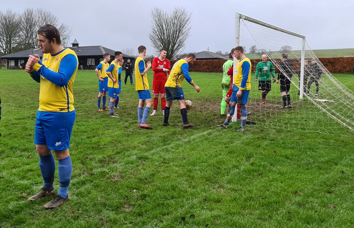 While a couple of buckets of sand were thrown on top of the tree root, the Copmanthorpe squad retreated for a team talk and a few members of the team decided to have a smoke.