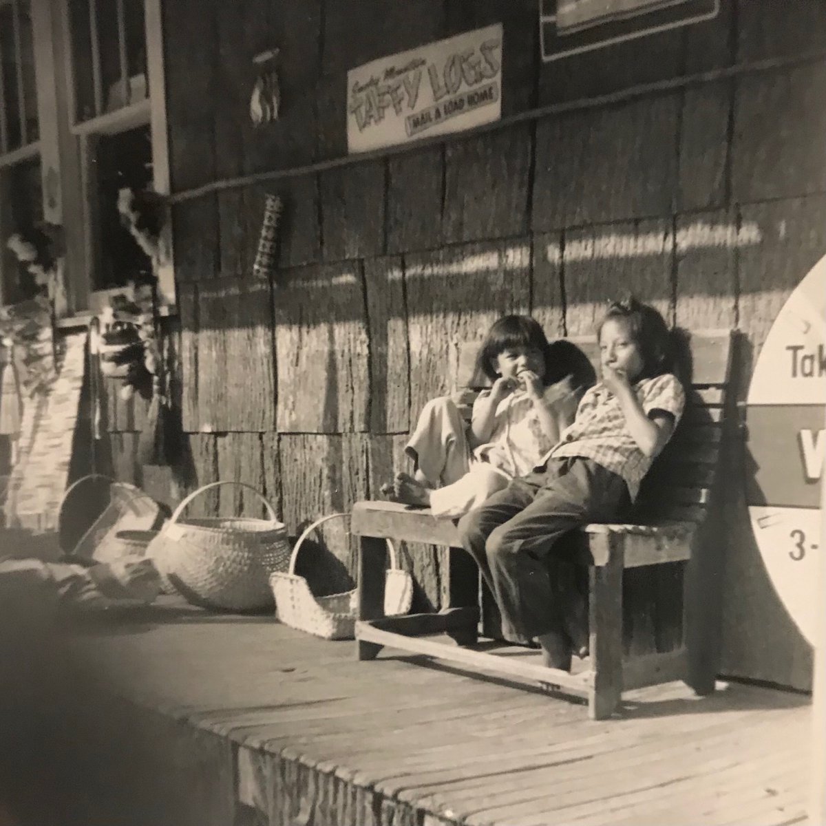 ashleyymad's tweet photo. Found a box of my grandfather’s old Polaroid photos circa ~1963. I can’t stop looking at this shot... two Cherokee children on the front porch of a store in Cherokee, NC. @VisitCherokee https://t.co/B4yUcvbLiM