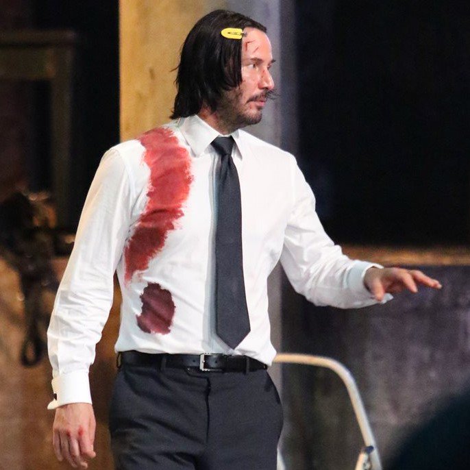 partygirlu2's tweet photo. today i offer you keanu reeves wearing yellow hair clips https://t.co/q17L0xzETc