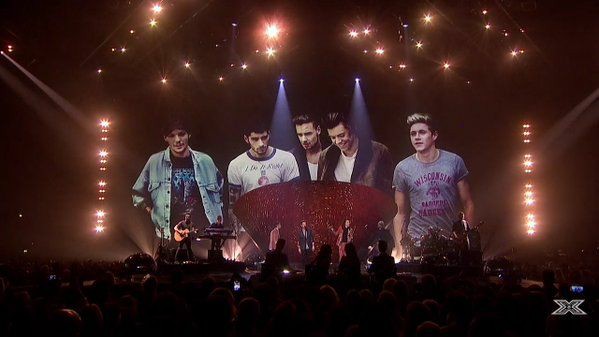 yourebestever's tweet image. While they were singing History, a snapshot of the band over the years were shown on a screen behind them 
#1DXFactor
#10YearsOfOneDirection 
#10YearsOf1D