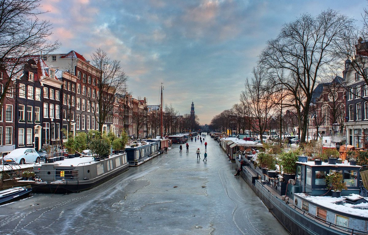Skaters on the canal, Amsterdam, Netherlands.