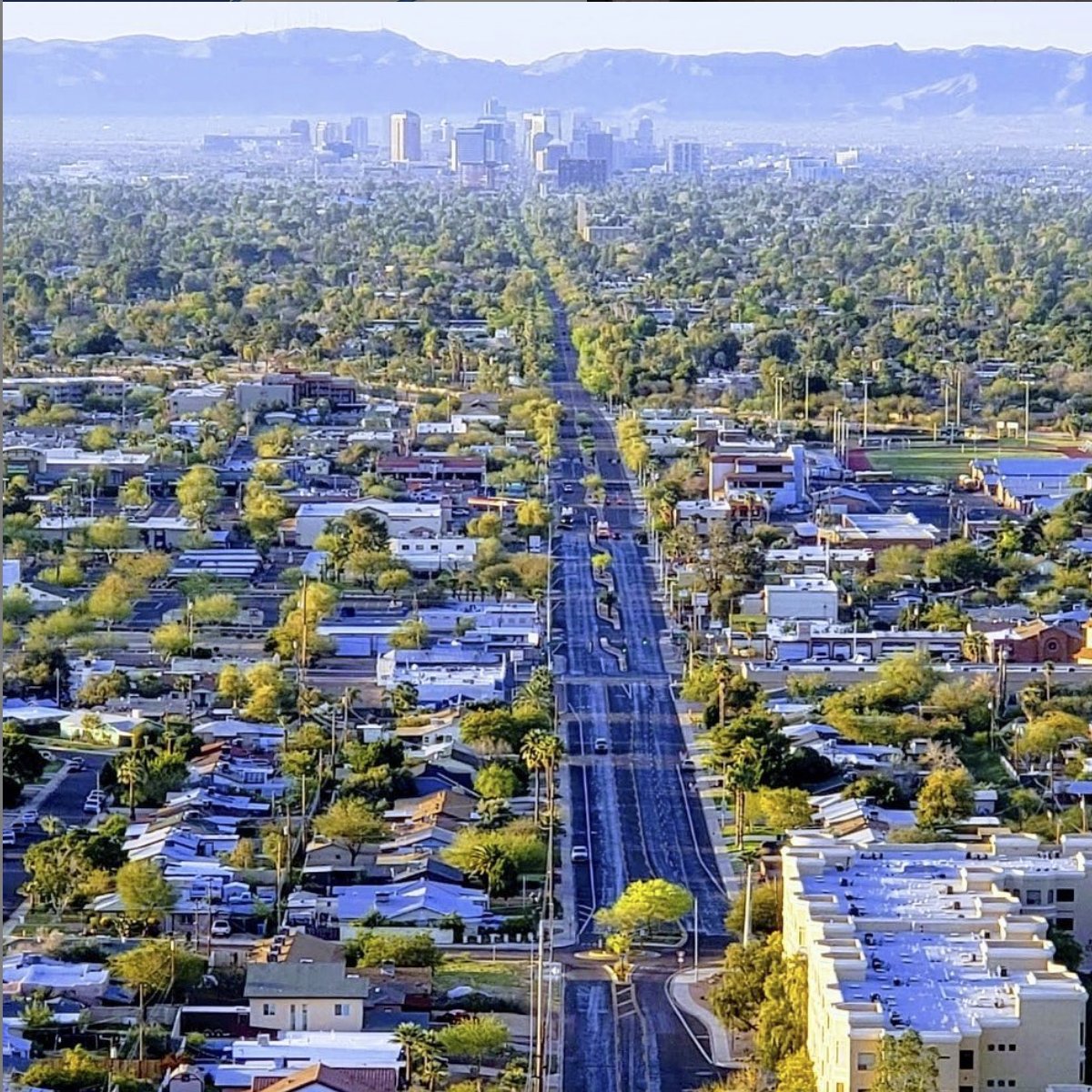 CityofPhoenixAZ's tweet photo. Looking back over the past year, one of our most popular photos was this shot from March: the low #buttes of #NorthMountainPark looking down #CentralAvenue towards the #mountains of #SouthMountainPark in the distance. #seeforever #PHX #Phoenix #Top202020 https://t.co/zyFqFrDUES