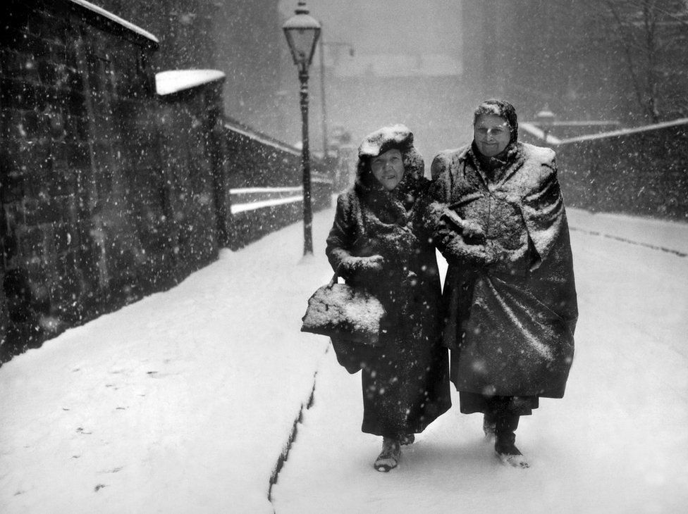 Day 14.The Ghosts of Christmas past  #AdventCalendar.Two ladies climbing the Garnet Street hill in Glasgow, 1952.Photo Herald Archives