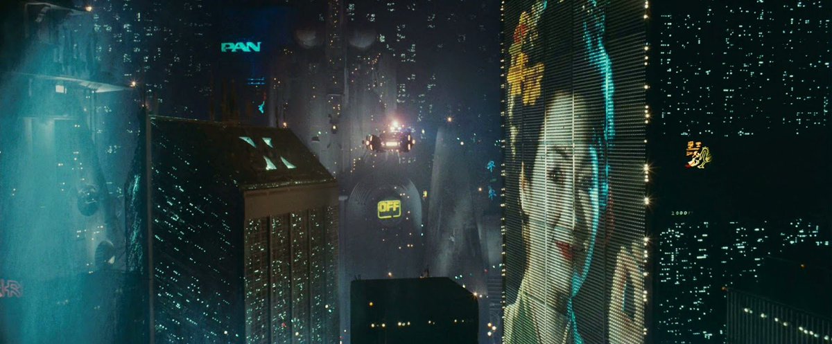 That's why in dystopian universe of  #BladeRunner, the cramped cityblocks that tower into a seemingly unending night is marked by literal Orientalist aestheticsIn this shot, the literal face of Japanese culture in the form of the geisha looms ominously over the city4/