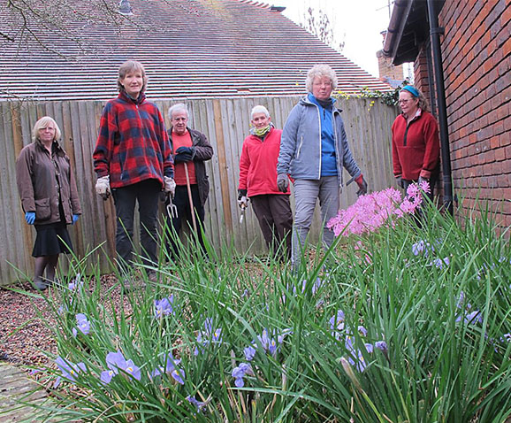 Our library may still be closed but the Friends' Gardening Gang continues to keep things tidy, although social distancing lends a touch of Reservoir Dogs to this picture.