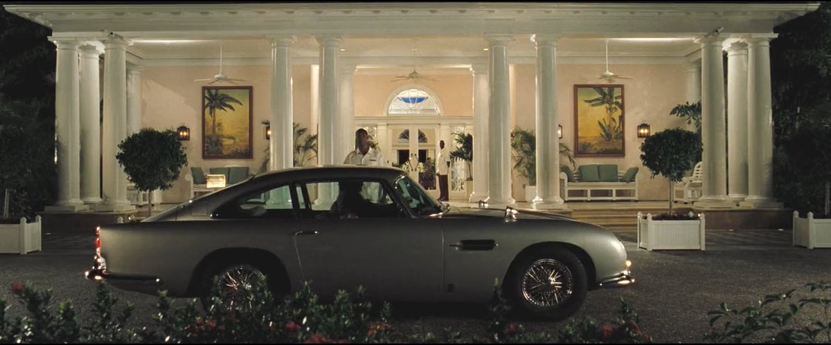 He wins a DB5 from Alex Dimitrios. We don't see it again but presumably he has it shipped back to the UK. So... is it personal property or does MI6 gets its grimy mitts on it?