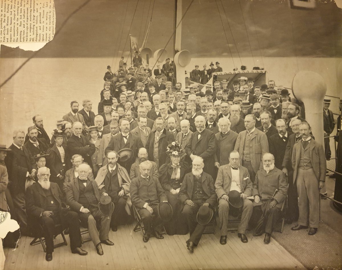 Moving through the scrapbook, a photograph was found loosely inserted between two pages. There was the answer. It must have once been placed at the back of the scrapbook where the ghostly figures were found.