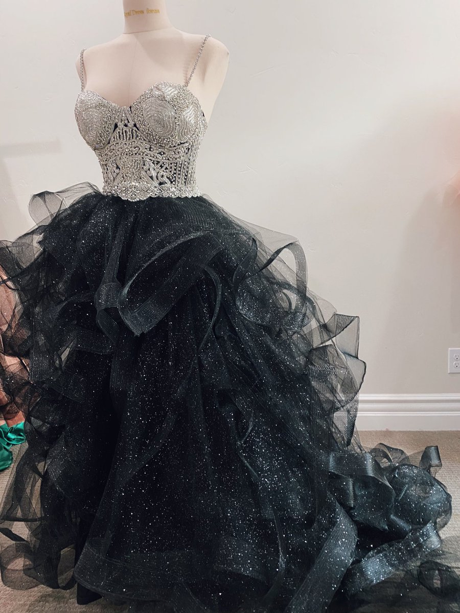 A black wedding dress the bride never picked up bc her wedding was cancelled, a sorcerer costume, strawberry dress but made with hand painted glitter pumpkins, rococo Marie Antoinette made with 8$ curtains and lace from the sides of pillows