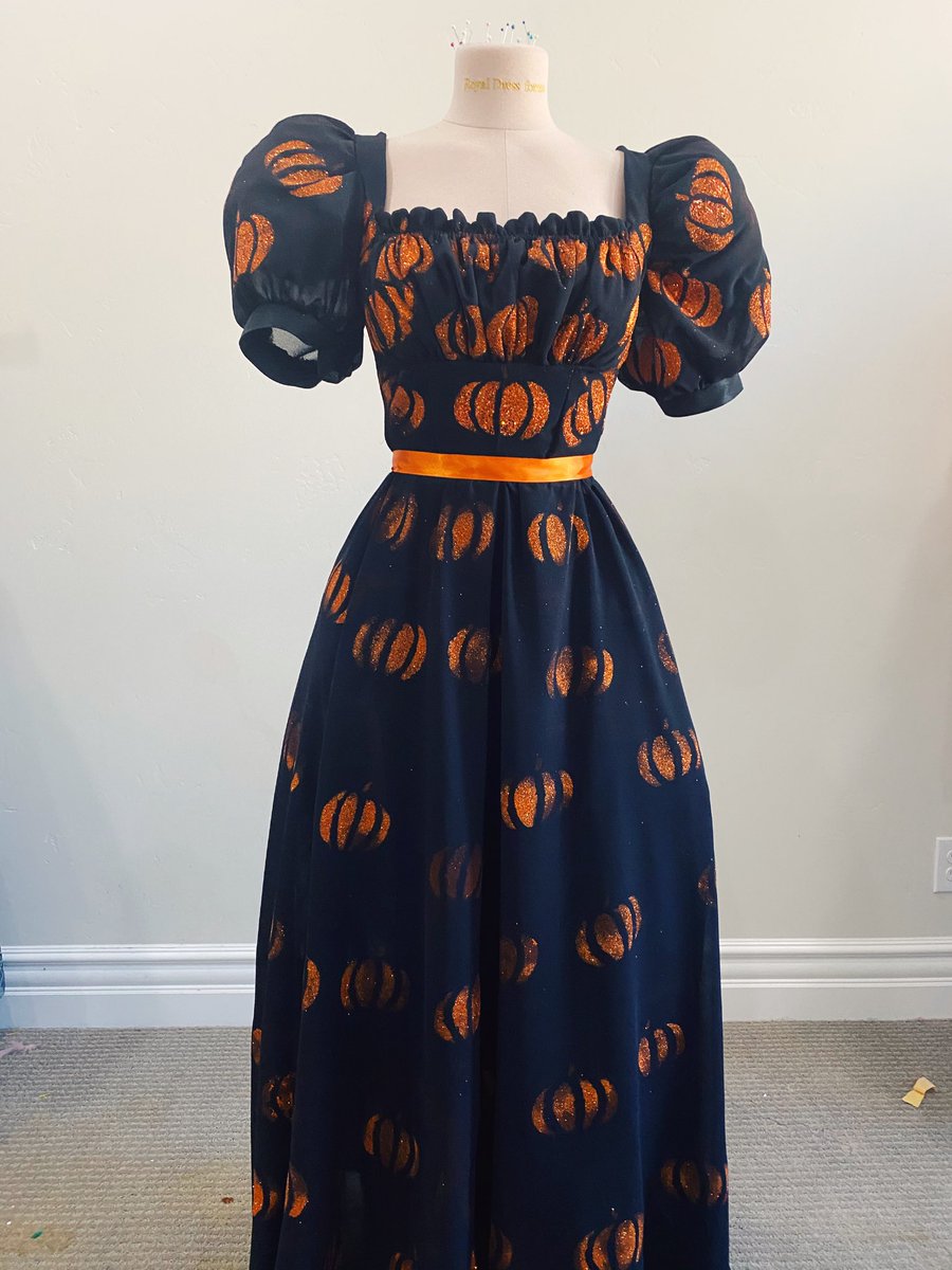 A black wedding dress the bride never picked up bc her wedding was cancelled, a sorcerer costume, strawberry dress but made with hand painted glitter pumpkins, rococo Marie Antoinette made with 8$ curtains and lace from the sides of pillows