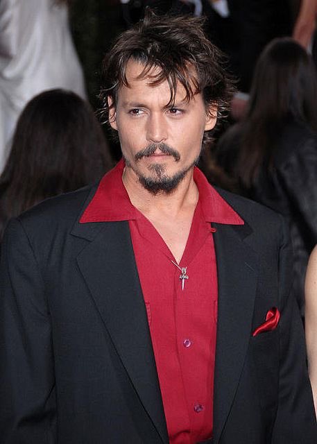 johnny depp as clip on earrings; a thread