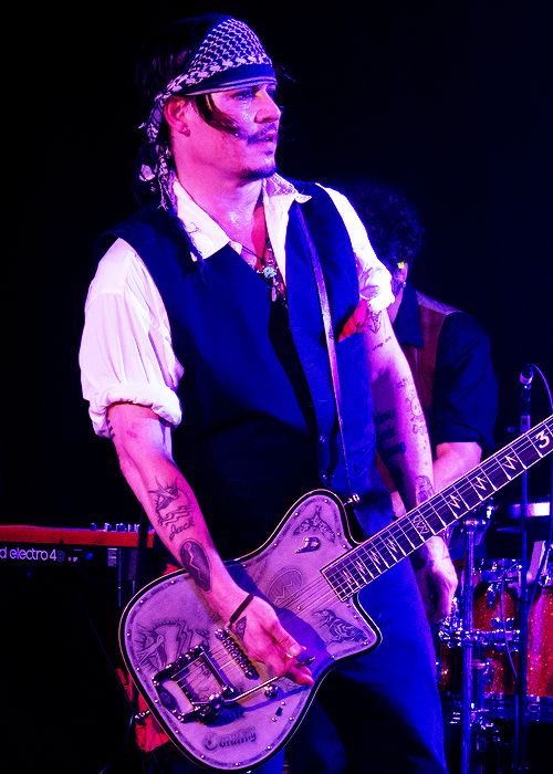 johnny depp as clip on earrings; a thread