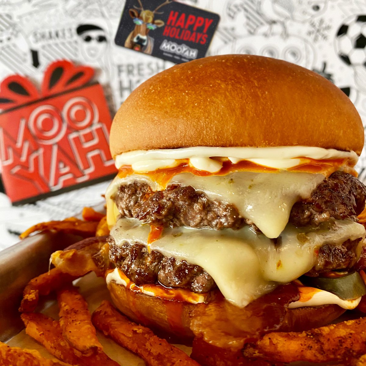 MooyahOC's tweet photo. Looking for the hottest gift this #holidayseason? Purchase a $25 #giftcard &amp; you’ll get a FREE #burger of your choice (redeemable on the #RewardsApp) thru 12/31. 🎄🎁🍔 #MOOYAH #Ridiculicious #bestburger #freeburger #irvine #spicyburger #doublediablo https://t.co/Vs5NcpdoVJ https://t.co/2SHwEq1zwS