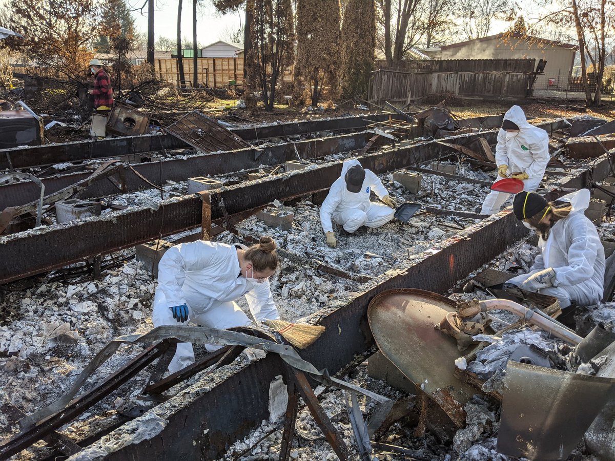 I stood there watching the archaeologists sort through what to me looks like a mass of undifferentiated ashes"Here's gypsum. This was the bathroom. This looks like a computer. So this would be the room with the boxes, correct?"But how?!