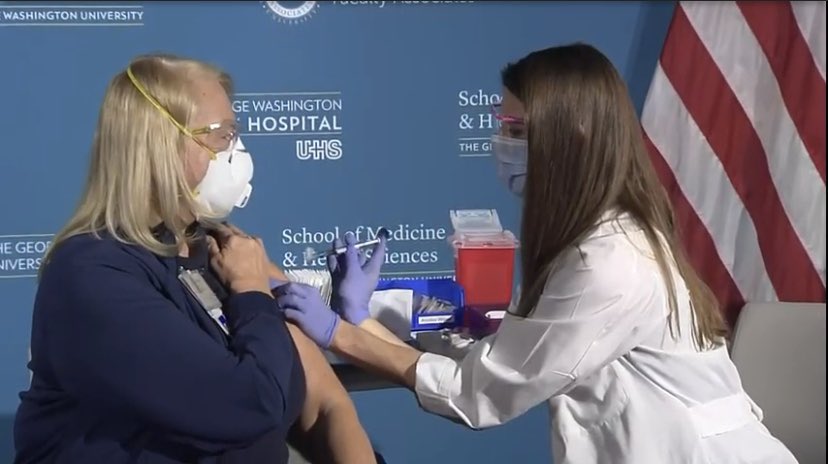 GWEMresidency's tweet photo. Our Charge Nurse Barb on TV getting the first COVID vaccine in our nations capital. Thank you @SecAzar and @Surgeon_General @JeromeAdamsMD for visiting GW! #GoGW #DefiningMedicine. @GWSMHS @GWHospital https://t.co/GuVH77uYiR