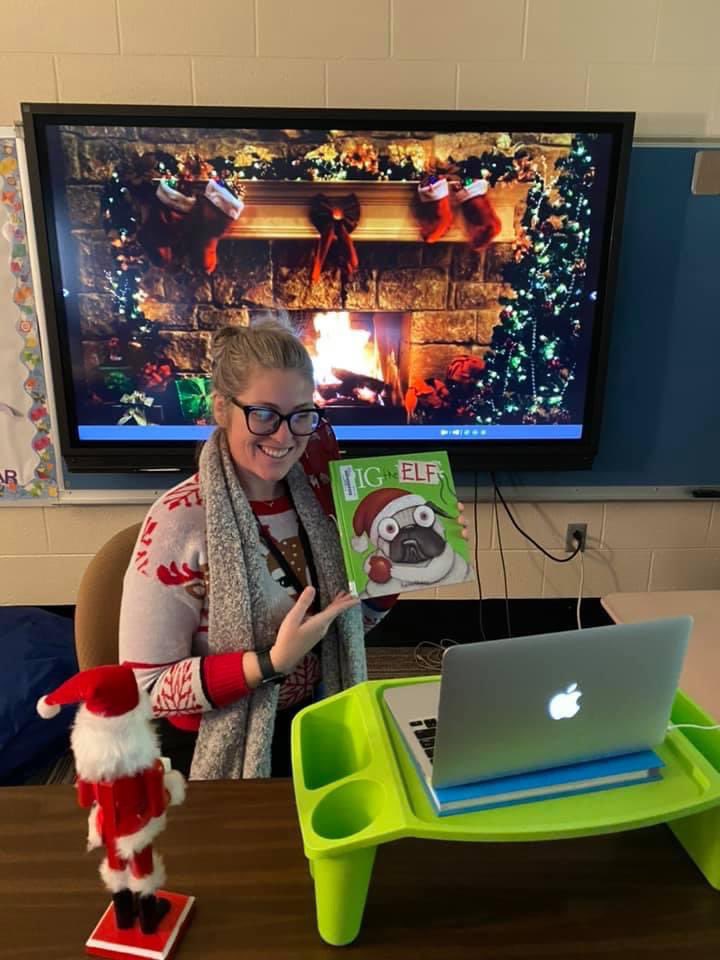 Cozy story-time and #SEL! This is a view of educators doing what we do best...improvising, connecting, and being extra (peep the fireplace)! 🙌🏾 Shoutout to Meghan, TA at Dogwood Elementary! #positiveschoolculture #SEL #storytime #pigtheelf #pigthepug