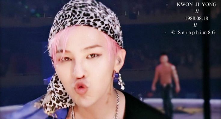 G-dragon makes this pouty duck face ; a thread
