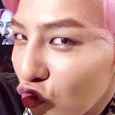 G-dragon makes this pouty duck face ; a thread