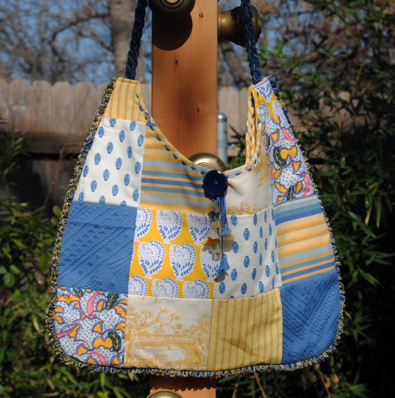 Rescuedoffering's tweet photo. Yellow and Blue Provence https://t.co/eJjjeuJPxo via @EtsySocial #etsyspecialt #specialTGIF #vintagebuttons #purse https://t.co/NQQJYdWNMN