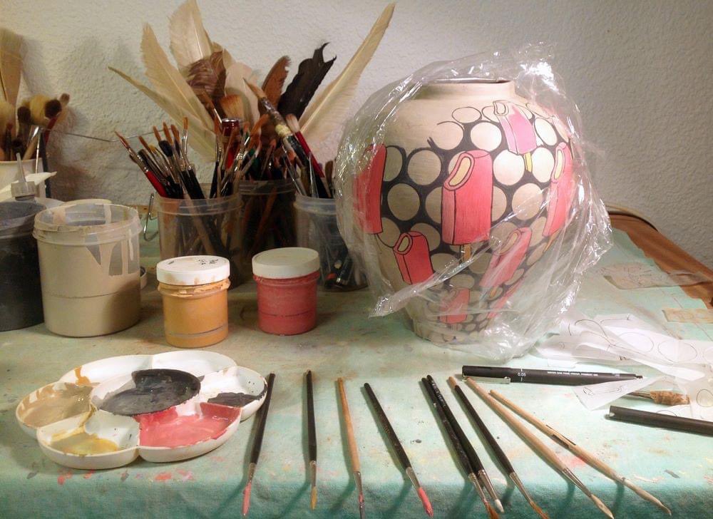 studioslipware's tweet photo. A little bit of bench here from late last year. Work in action on a small jar, kolinsky riggers, pots of slip and guilty clingfilm, not sure what to do about or with the left over clingfilm, but I couldn’t work without it.
#slipware
#workinprogress
#studio
#kittyshepherd https://t.co/SkbLqPmsCh