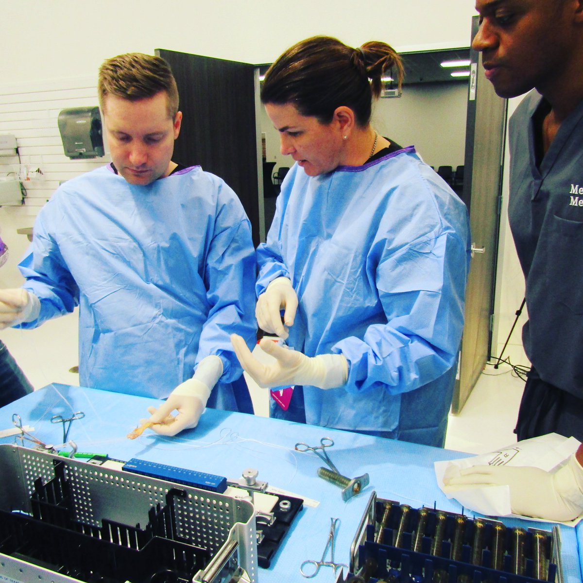 ortho_ut's tweet photo. Mark Irby, PA-C (L) & Shae Sloan, MMS, PA-C (C) practicing new techniques for graft preparation in #aclsurgery under the watchful π of @DrPhilWilliams (R) Thanks #arthrex #medinc for hosting us ππΌ #utortho #sportsmedicine #orthotwitter #orthopaedics #physicianassistant #graft https://t.co/rDwOXTGi8Q
