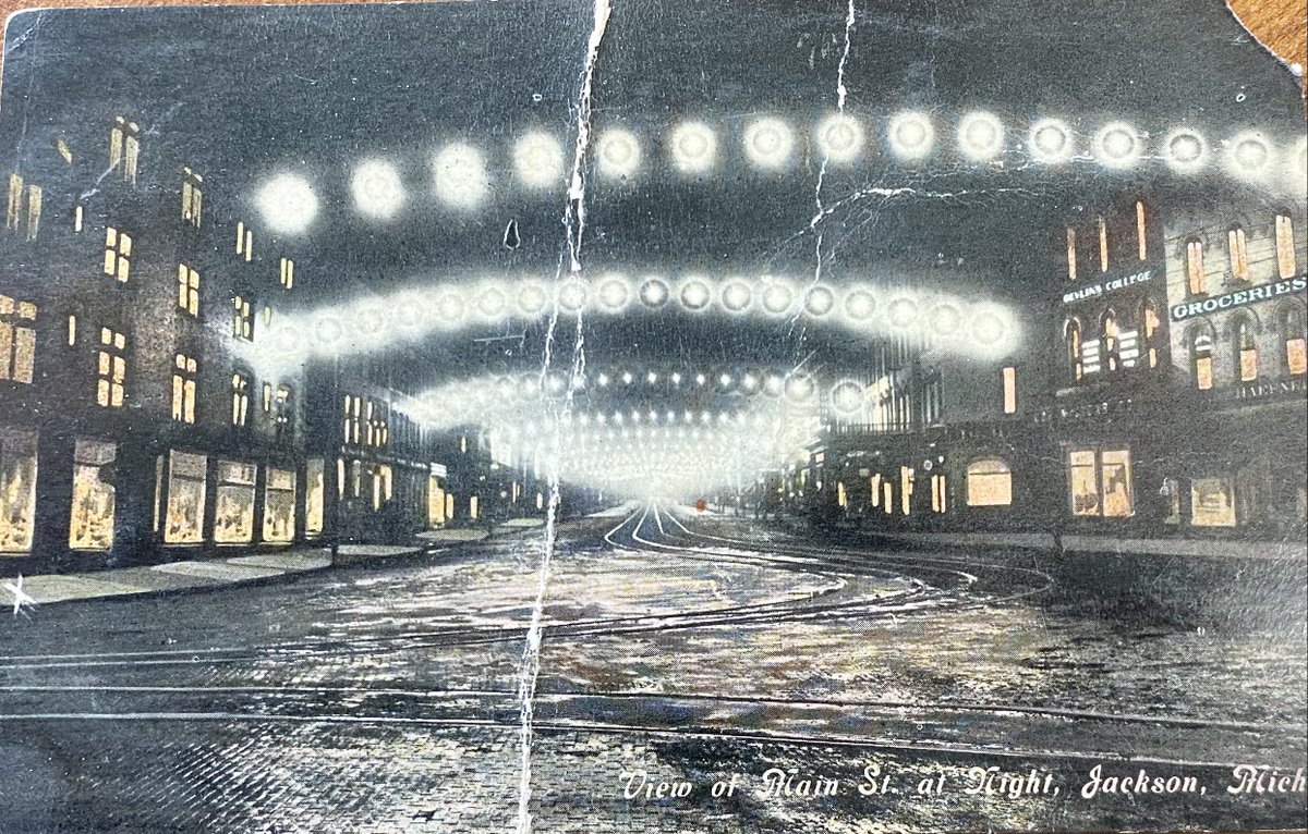 CityOfJacksonMi's tweet photo. Here's a lovely view of @downtownjxn from an early 1900s postcard. It looks west down Main St, now Michigan Ave. The buildings on the right have been replaced by One Jackson Square, but on the left the buildings remain such as the Otsego Apts. #throwbacktuesday #jacksonmi https://t.co/l0tsZcEl43