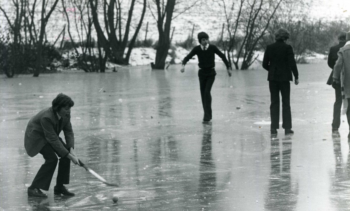 CS1865's tweet photo. 'Ice' hockey on Gatley's, the @cranleighschool pond, in 1976-77. Until the late 1970s skating in cold weather was encouraged and in the big freeze in 1962-63 an inter-house ice hockey competition was held. #FromtheArchive @SchoolArchives1, #SchoolWinter https://t.co/wB9OqZsRbo