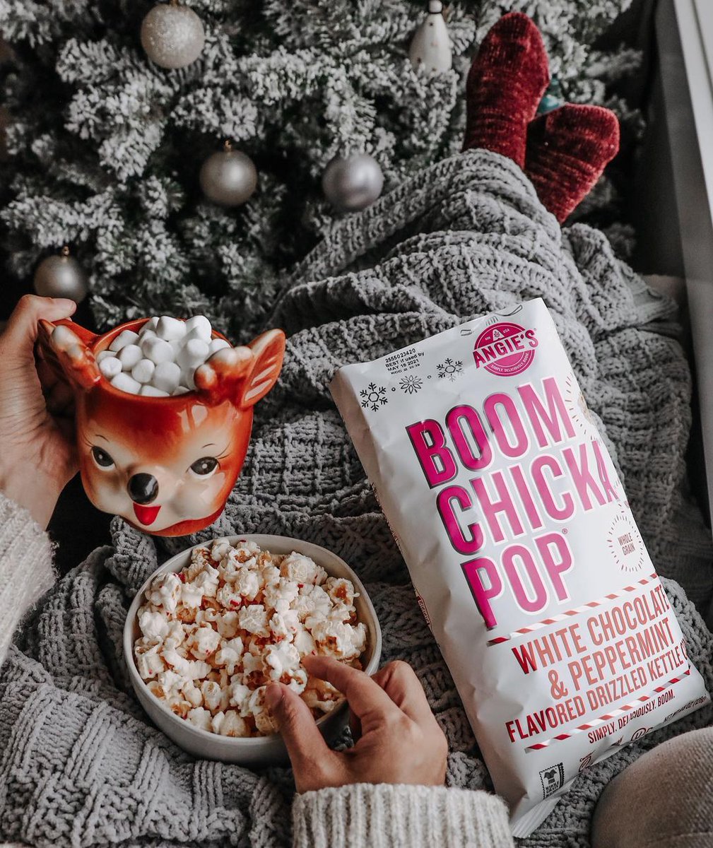 Who else is still watching Christmas movies on repeat? 🎄 We're putting on our fuzzy socks, drinking hot cocoa, and snuggling with our favorite bag of White Chocolate & Peppermint popcorn! ❄️ @greyslittlecloset