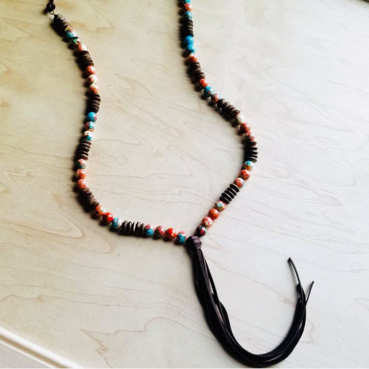 Multi-colored turquoise necklace with leather tassel. #shoplocal #bohostyle #jewelry #giftsforher #stockingstuffer #christmas Shop online at: shopthegroveboutique