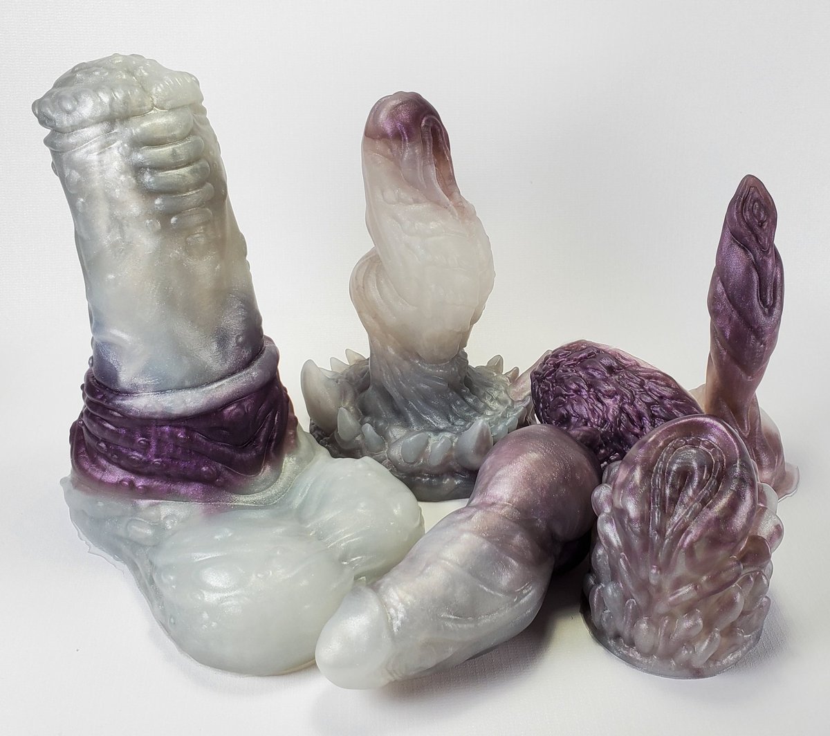 strangebedfella's tweet photo. Oooh!! The first pour of the day that my husband Patrick and I made for #SBShopDay came out looking lovely! Frosty white and a splash of plum 💜 All of this is in medium silicone! https://t.co/XGQTfhyuff