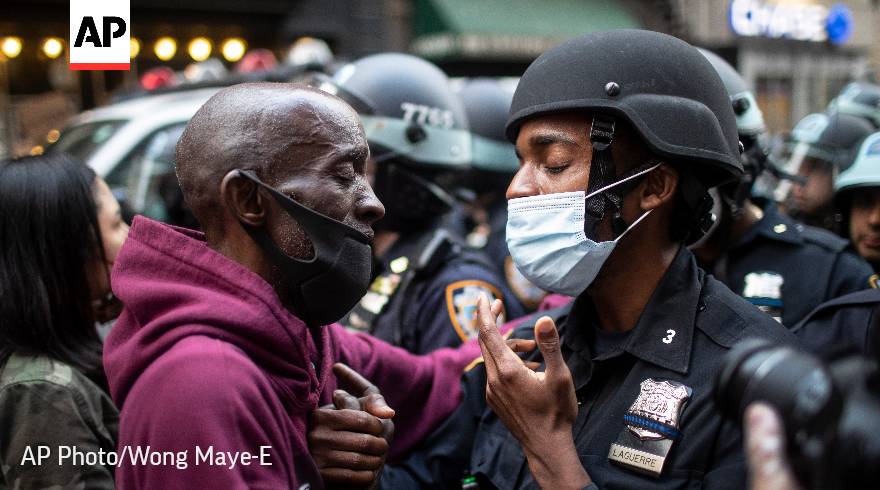 AP's tweet photo. The @AP 2020 photos of the year captured a world in distress. Following the death of George Floyd, racial justice protests erupted across the United States.

See our best photos of the year. #APPhotos2020 https://t.co/4fGmuHs8hB