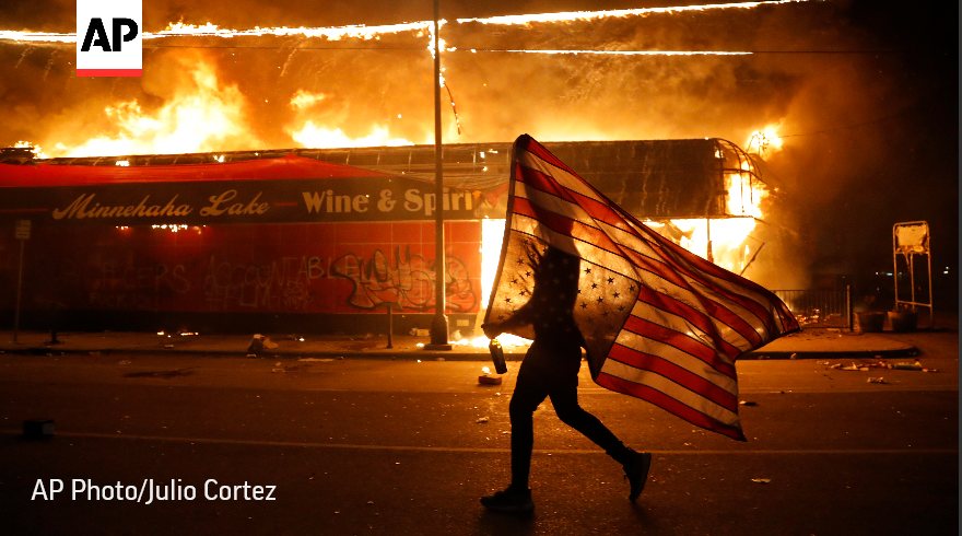 AP's tweet photo. The @AP 2020 photos of the year captured a world in distress. Following the death of George Floyd, racial justice protests erupted across the United States.

See our best photos of the year. #APPhotos2020 https://t.co/4fGmuHs8hB