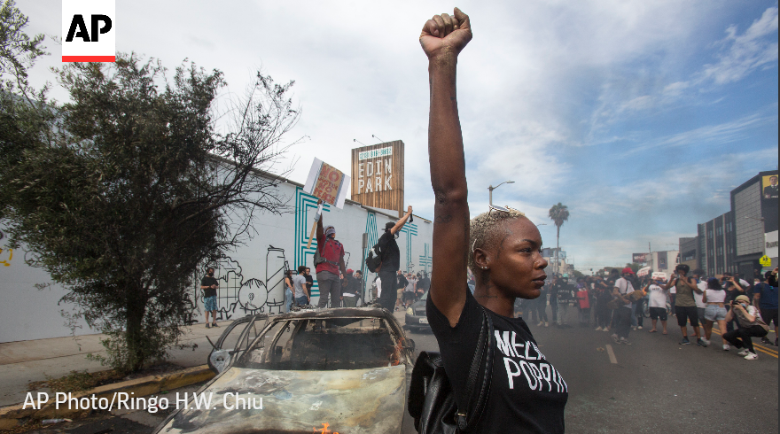 AP's tweet photo. The @AP 2020 photos of the year captured a world in distress. Following the death of George Floyd, racial justice protests erupted across the United States.

See our best photos of the year. #APPhotos2020 https://t.co/4fGmuHs8hB