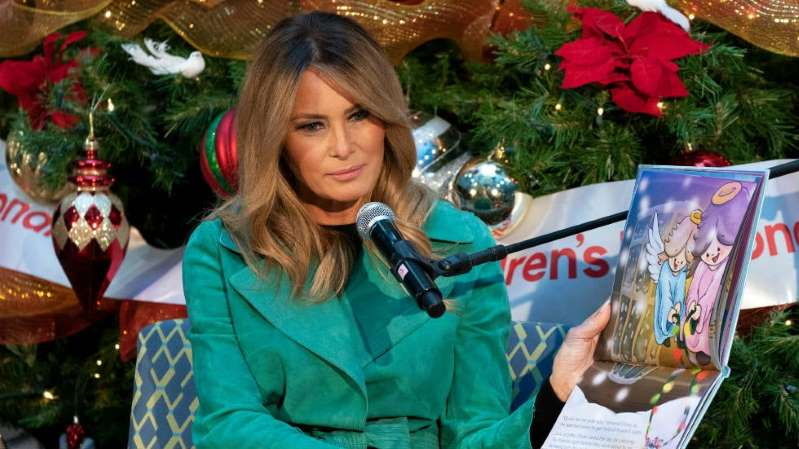 2016nothappy's tweet photo. Melania Trump removes mask to read to young patients, breaking hospital's rules. she is an idiot just like her bigot uncaring husband. she looks tired &amp; worn out - how sad. now she has to go back to her old profession ???? how fitting for such a loser first lady. https://t.co/ajPAZbgpIA