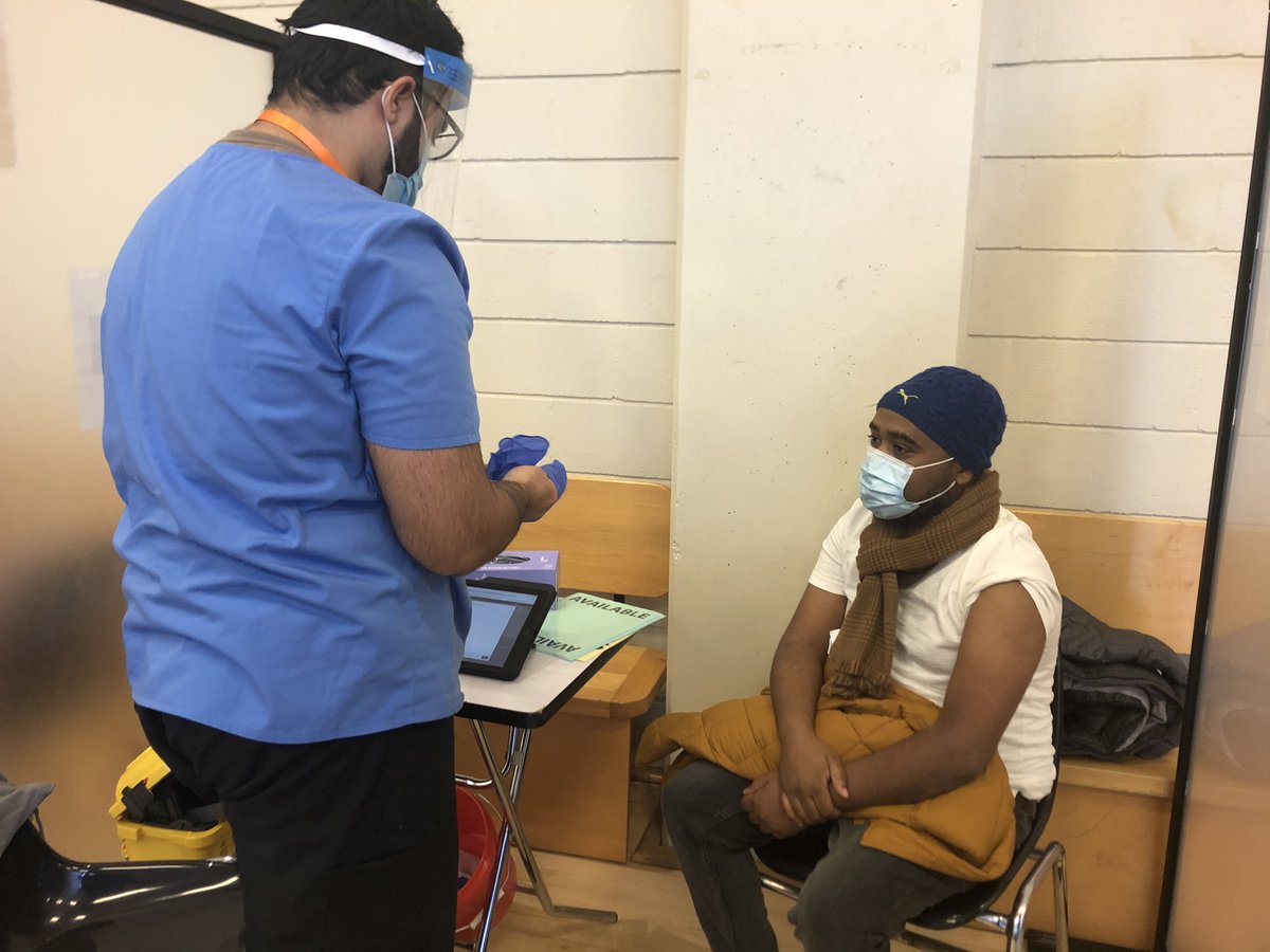 caryn_lieberman's tweet photo. For ten months @tylerthornley & I have seen #frontlineworkers put their lives on the line, and their patients’ needs first, while many of us have #workedfromhome. Seeing them roll up their sleeves today to protect themselves from #COVID19 is quite surreal. https://t.co/m4eAKgRD4s