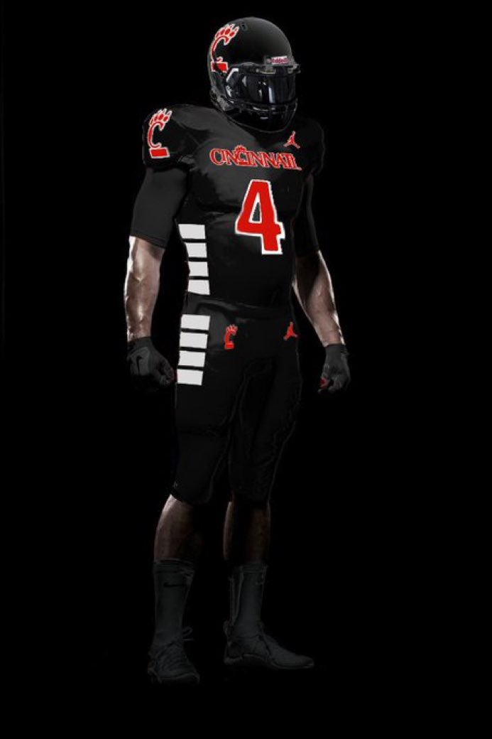 UCUniforms's tweet photo. People could use a distraction from tonight’s joke of a television show, so @Captain_Cincy and I would like to show you the black version of these #CFBRR uniforms! 

#Bearcats https://t.co/0wc3HNnSig