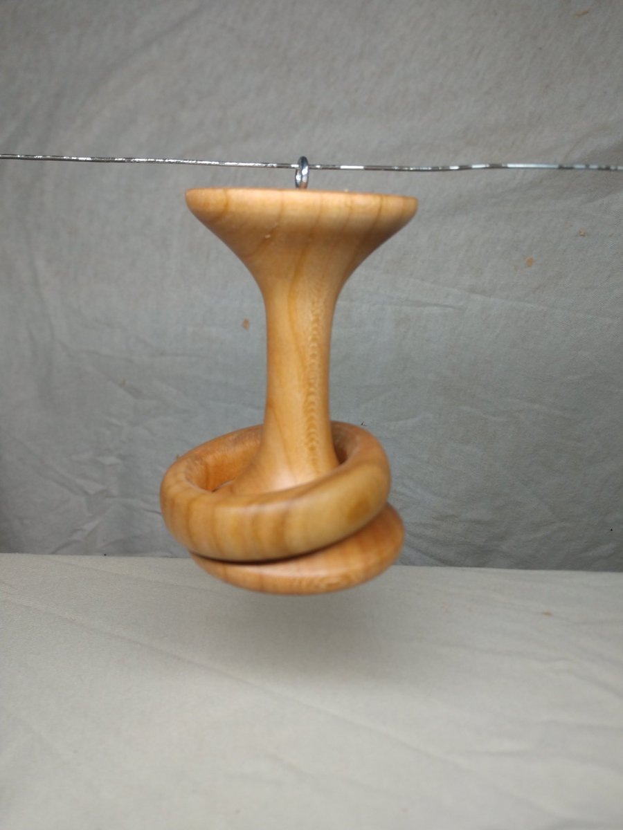 AndyHollenbeck's tweet photo. As some of you may know, over the last year, I've been doing some woodturning on a lathe. This week I've been working on ornaments. This one might be one of the pieces I'm proudest of to date. My very first "captive ring". #Woodturning #WoodLathe #ChristmasOrnaments #CaptiveRing https://t.co/TIUyyiucai