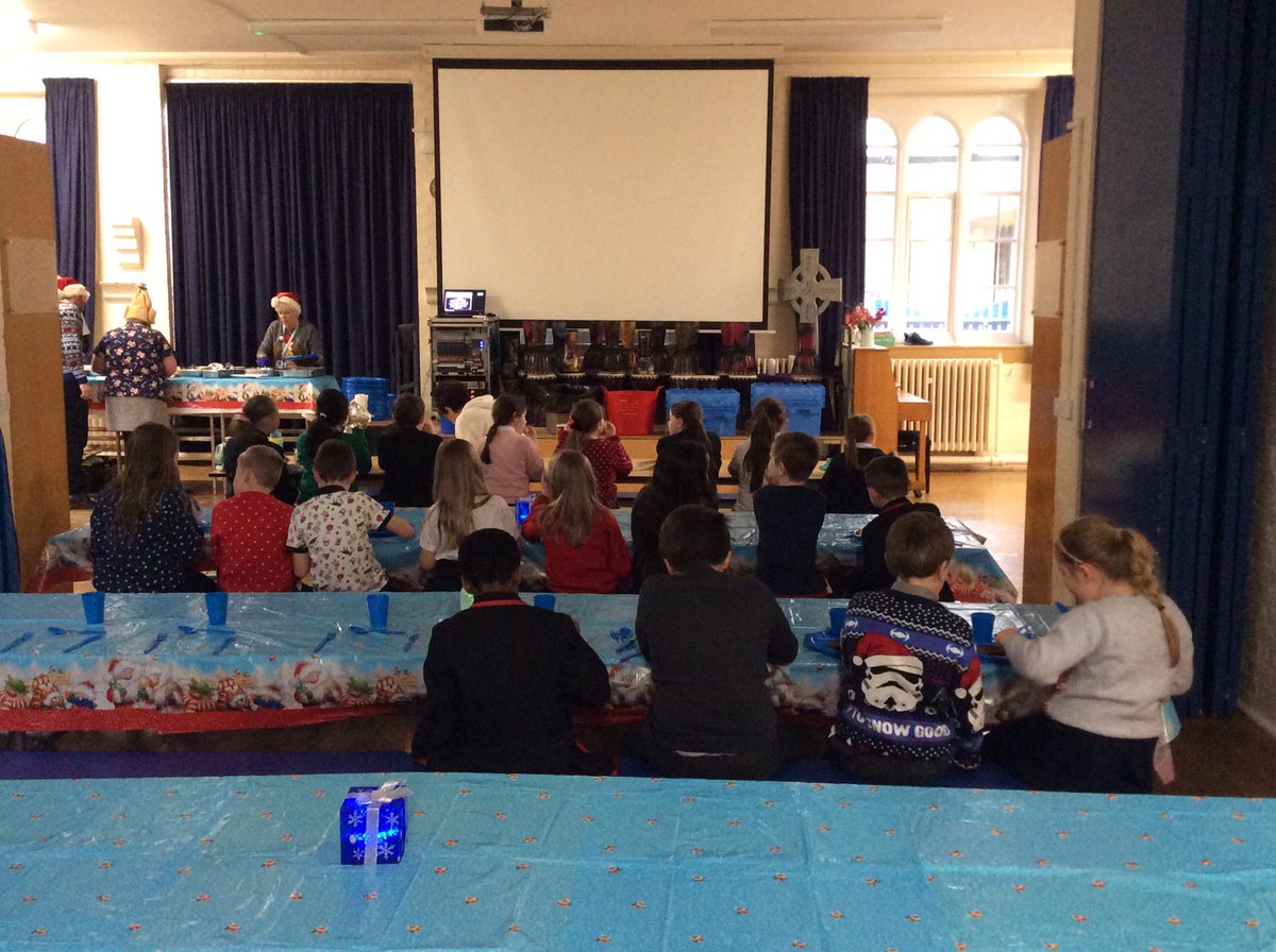 Year 3 and 4 children enjoying their Christmas lunch. A festive atmosphere created by the midday supervisors for our Christmas dinner today. <a href="/National_Junior/">The National Church of England Junior School</a>