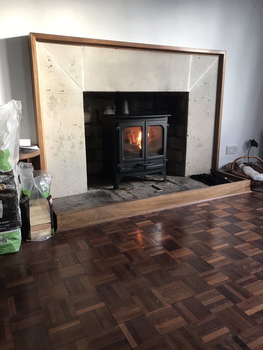 CorrallsCoal's tweet image. A @CharnwoodStoves island 1 multi fuel stove finished in black with stone surround trim and @EurocowlLtd top guard fitted in #shalfleet #IsleofWight #multifuelstove #fireplace