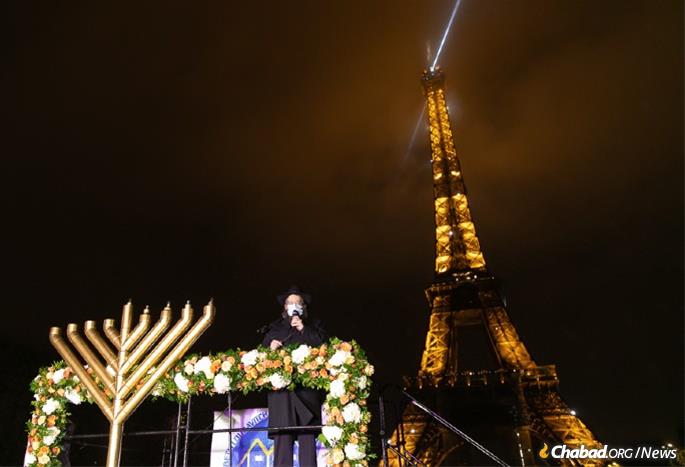 Paris France Read More:  https://www.chabad.org/news/article_cdo/aid/4978759/jewish/Paris-Mayors-Surprise-Request-Keeps-Eiffel-Tower-Menorah-Tradition-Alive.htm#utm_source=twitter&utm_medium=social&utm_campaign=tw_en