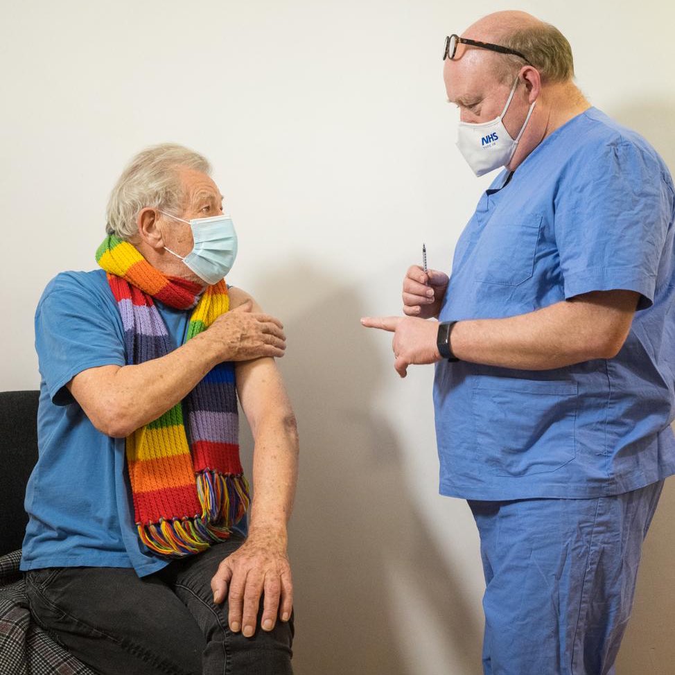 Sir Ian McKellen with an NHS staff member, about to receive the first dose of his COVID vaccine.