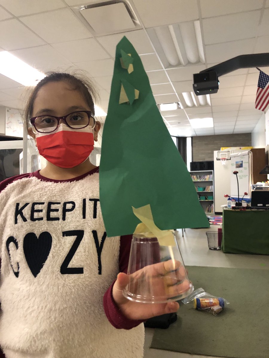 MrsGumsDIS's tweet photo. My students accepted the challenge. Who can design the tallest tree that can stand on its own? BUT you can only use 1 sheet of green paper, a cup, and a foot strand of tape. They rocked this challenge! #steam ⁦@LeaphartElem⁩ https://t.co/eK5WfqClBt