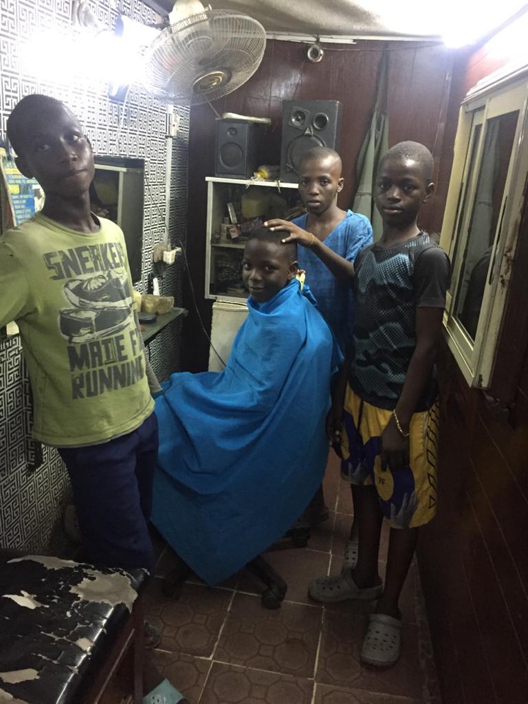 Based on popular demand, I rush to the shop and met them cutting one of their friend..From L-R Emma, Ebuka, Onyeka(with clipper) and Khalid..Thank you guys so much!