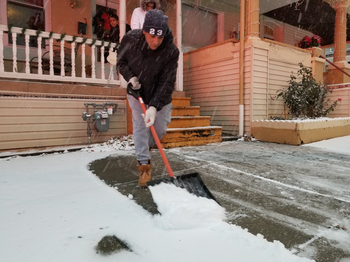 BerksMichelle's tweet photo. Mario Deleon of 740 N. Front St. clears snow from his sidewalk Wednesday evening during the storm. #berksweather https://t.co/ROlJnsSskd