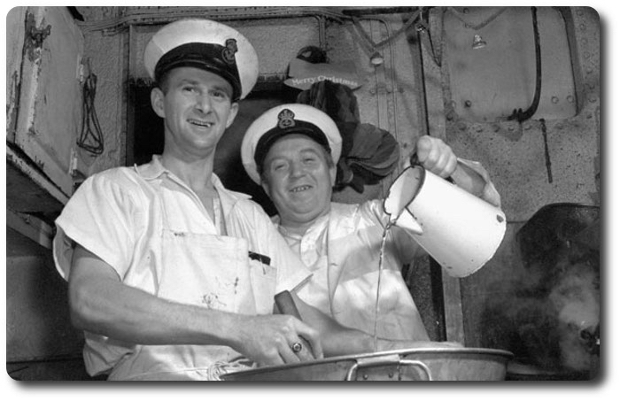 Mixing rum into the Christmas pudding HMCS Assiniboine, Dec 1940. Photo courtesy of Library &amp; Archives Canada, MIKAN 3567053. #RCNavy #Christmas2020 #Navy #WW2