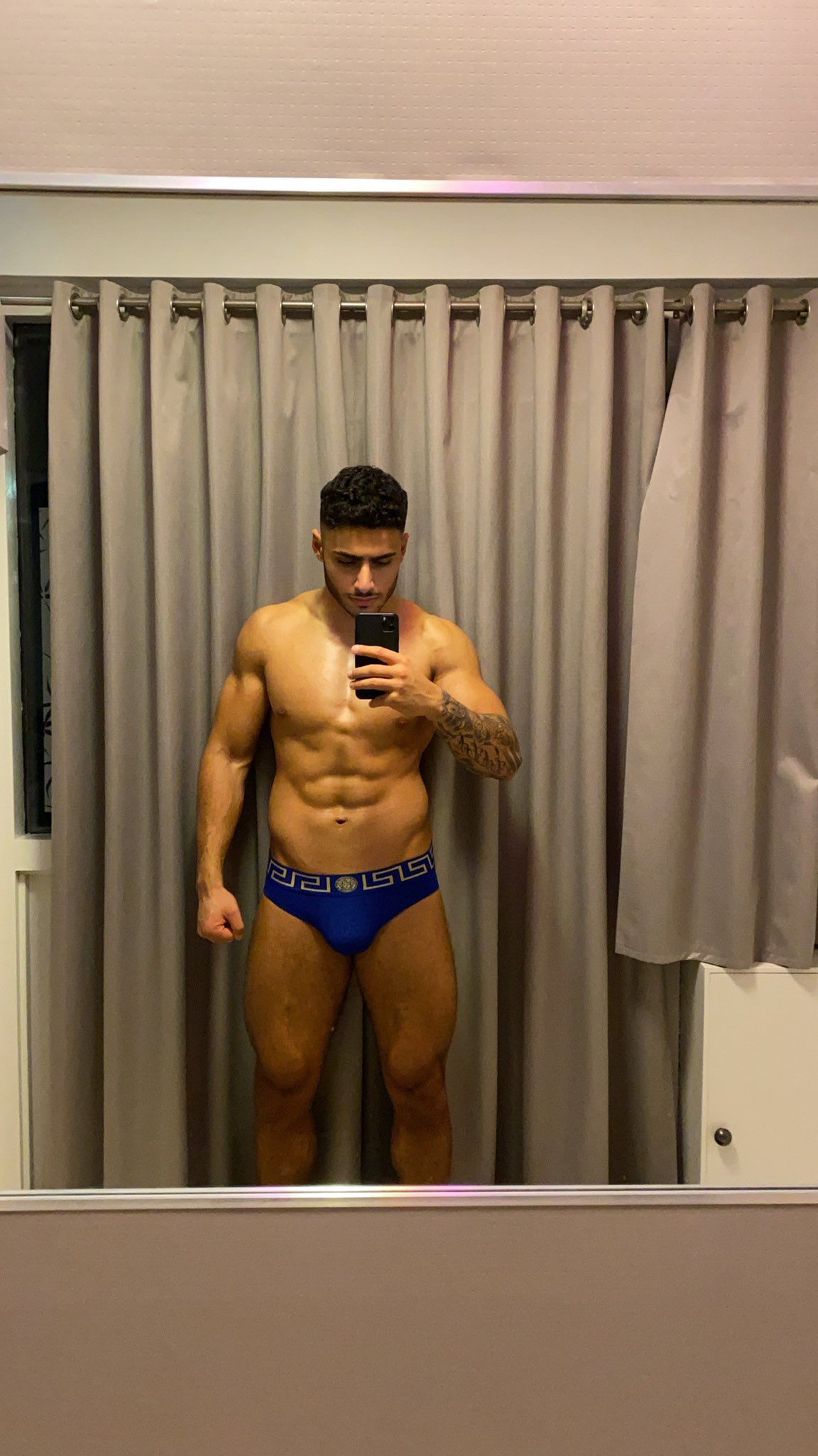 FitNarad in a tender embrace with another man