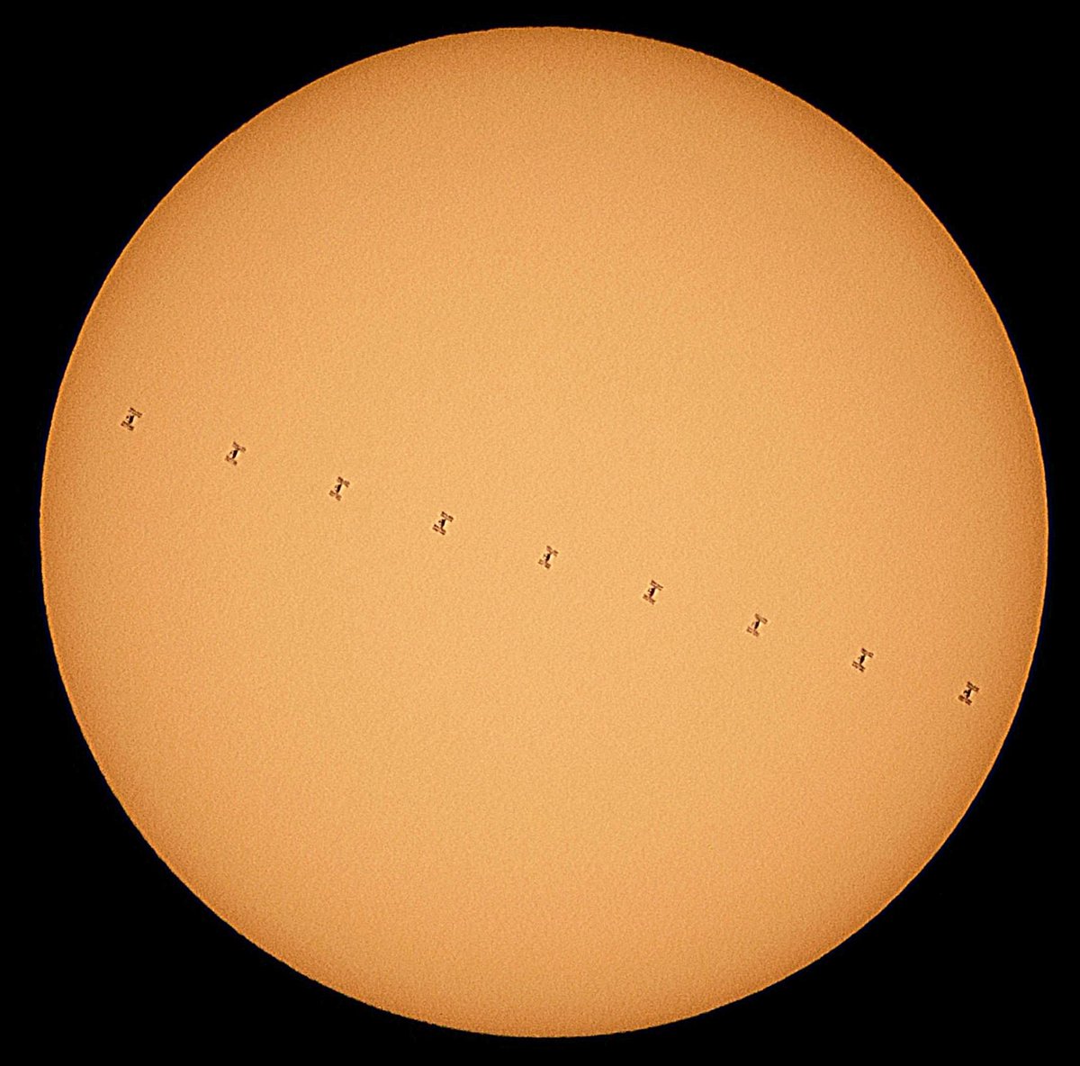 On April 10th, the  #InternationalSpaceStation transited the Sun. My home in London was directly under the epicentre of the flight path. The transit lasted 1.8 secs. From the video in white light I extracted 10 evenly distributed frames which were stacked and processed with colour