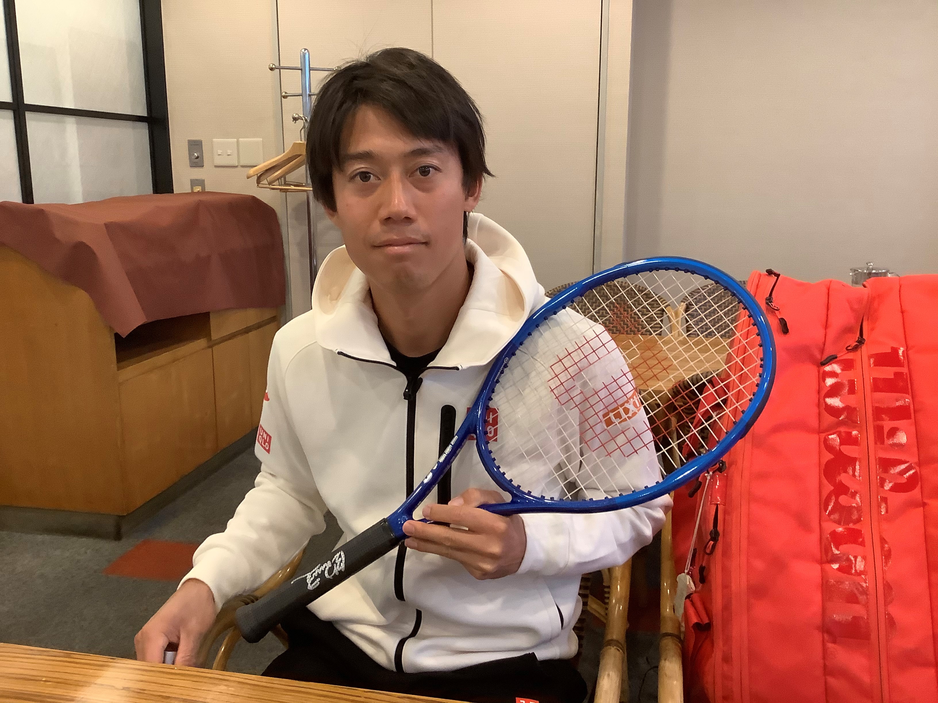 Kei with the racquet he played with in Rio Olympics