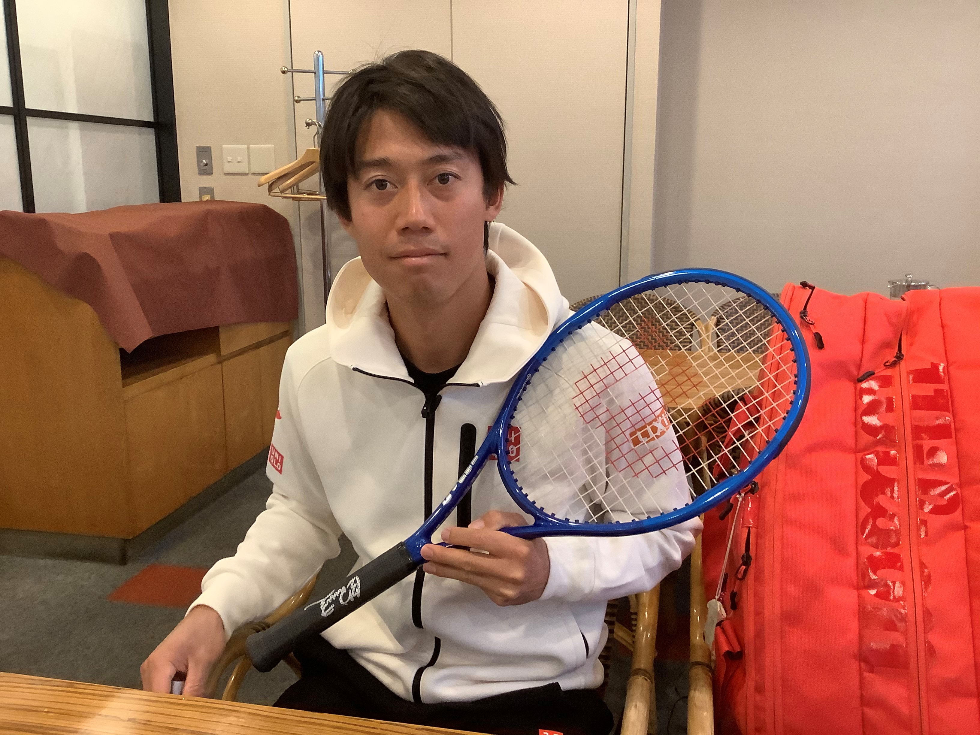 Kei with the racquet he played with in Rio Olympics